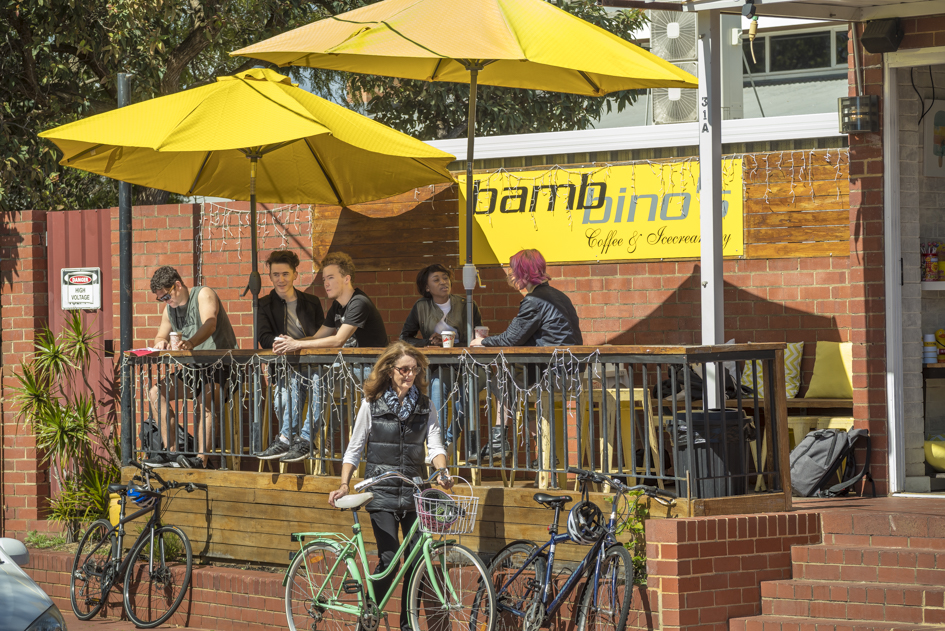 Image of people walking and riding bikes