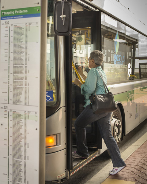 Woman boarding a bus